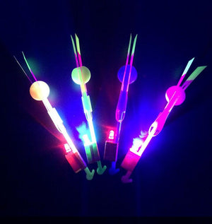 100Pcs/lot or 50pcs Amazing Light Arrow Rocket Helicopter Flying Toy LED Light Flash Toys Party Fun Gift Rubber Band Catapult